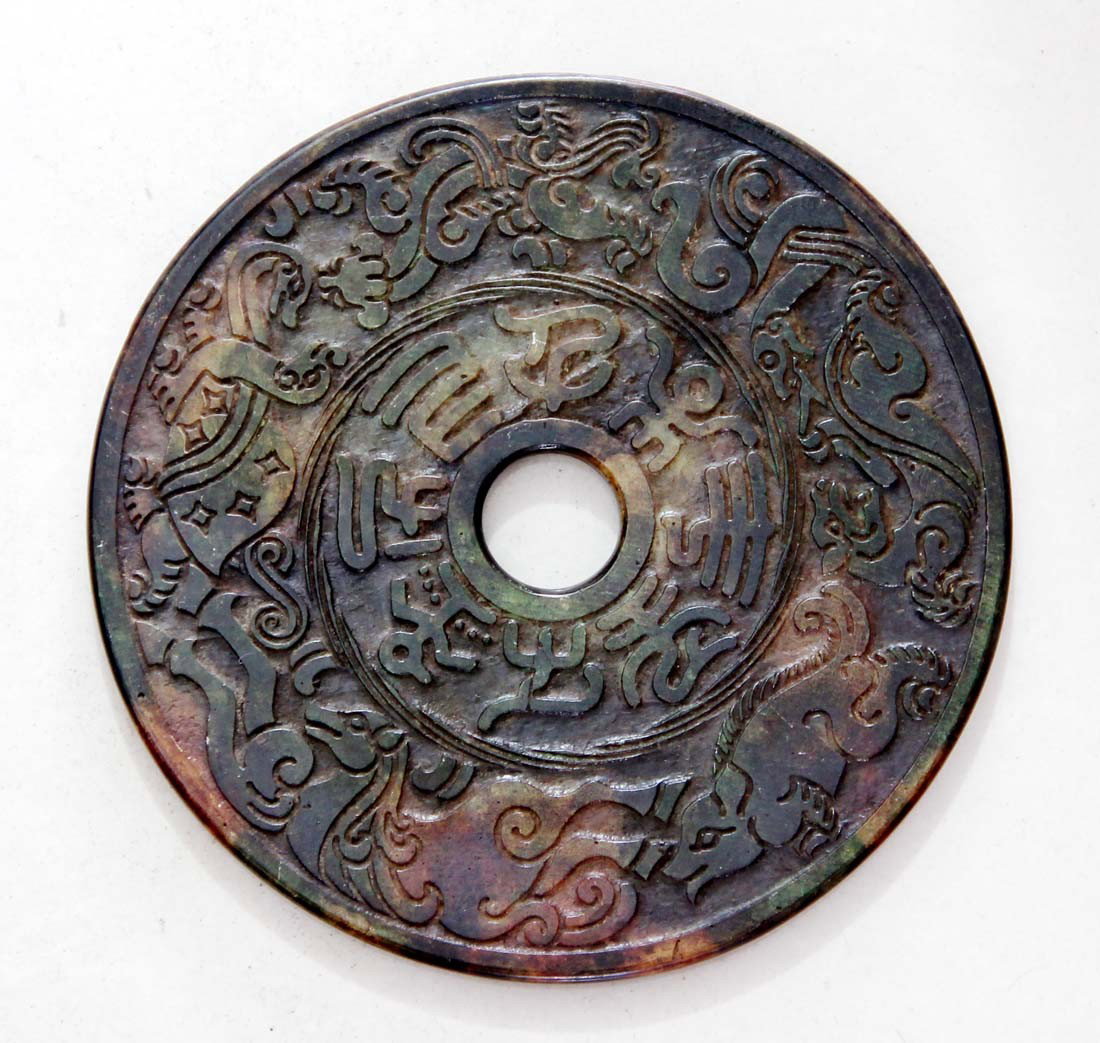 ANTIQUE 625 CT CHINESE JADE CARVING DISC: The Royal Cameo Carving Jade Charm was carved from a piece of fine grained Jade gemstone more than 200 years ago. The design is unique and very lovely and the carving is delicately performed. Size: 62
