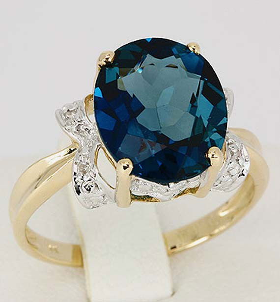 5.03 CT Genuine London Blue Topaz & Diamonds $4,800: London Blue Topaz 5.03 ct. (Prong setting, Oval 12x10 mm = 1) Diamond 0.02 ct. (Pave setting, Round s/c 0.005 ct = 4) H-I diamond color, I1-I2 diamond clarity . Size 7, comes with certificate.