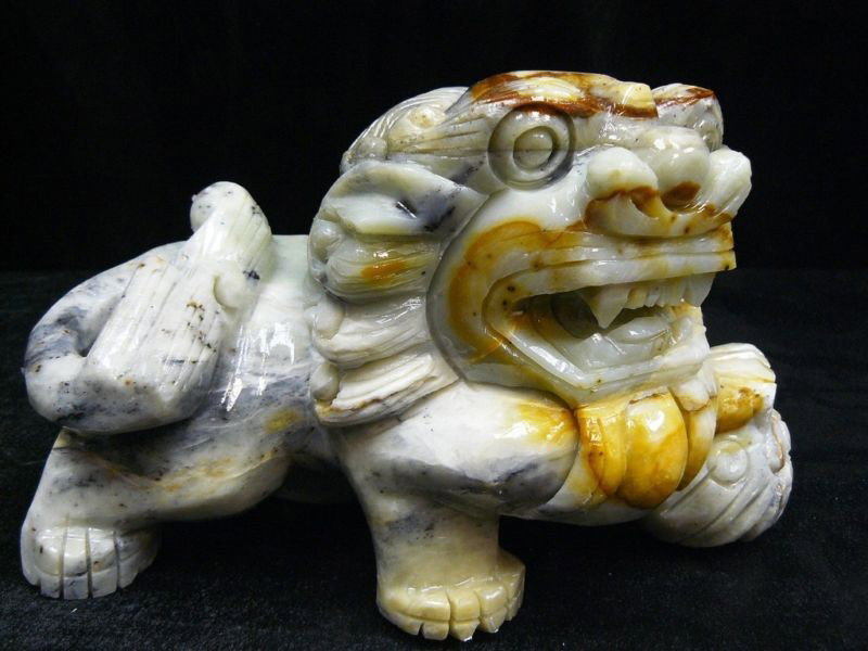 Hand Carved Oily Jade Lion / Foodog: This lion is made from one solid piece of Oily Jade, very smooth with rich colors. Light green with some spots dark green, yellow, brown and black. The colors are all natural. Individual Size: Long: 1