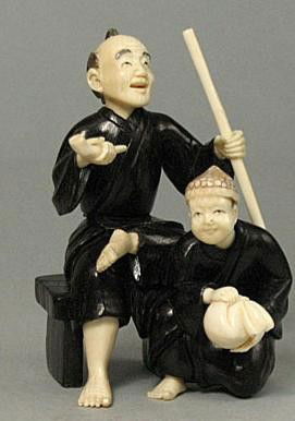 Mammoth Ivory & Ebony Iron Wood "Old Man & Kid" Oki: 100% Genuine Mammoth ivory & Ebony Irone Wood handcrafted "Old Man & Kid" okimono, size: 2-1/2" x 1-3/8" x 1-5/8" (64mm x 35mm x 42mm). This okimono is carved by our artisan. The carving is very detai