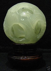 REAL JADE 5 LAYER PUZZLE BALL: THIS WONDERFUL PIECE OF WORK IS MADE OF REAL JADE. IN ONE PIECE OF SOLID JADE, WE CARVED IN A FEW LAYERS AND IT IS CARVED FROM INSIDE OUT. THE MOST INTERESTING PART OF THIS ITEM IS THAT ALL THE BALLS 