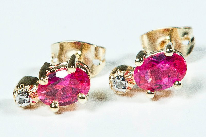 Genuine .85 CT Ruby Diamond Earrings: Master jewelers designed your earrings with 2 pieces of GENUINE 6X4mm faceted oval rubies. 2 pieces of GENUINE single cut diamonds .03 carat tw. 1.3 grams of sterling silver layered with 18K Gold. The