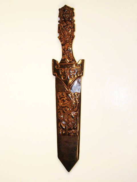 Chinese Hong-San 650 CT Jade Dragon Sword: The Royal Cameo Carving Jade Charm is hand carved from a piece of fine grained Jade gemstone. The design is unique,lovely and the carving is delicately performed. Size: 650 Carat Approx Size: 9" x 1 1