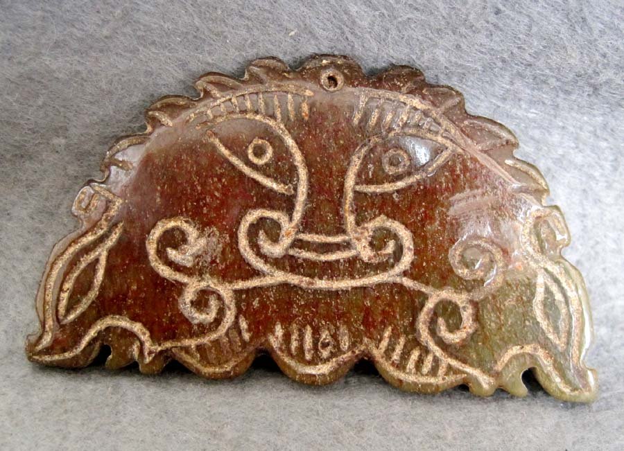 Hand Carved 400 CT Jade Sun Mask Carving: The Royal Cameo Carving Jade Charm is hand carved from a piece of fine grained Jade gemstone. The design is unique,lovely and the carving is delicately performed. Size: 400 Carat Approx Size: 2 1/2" x