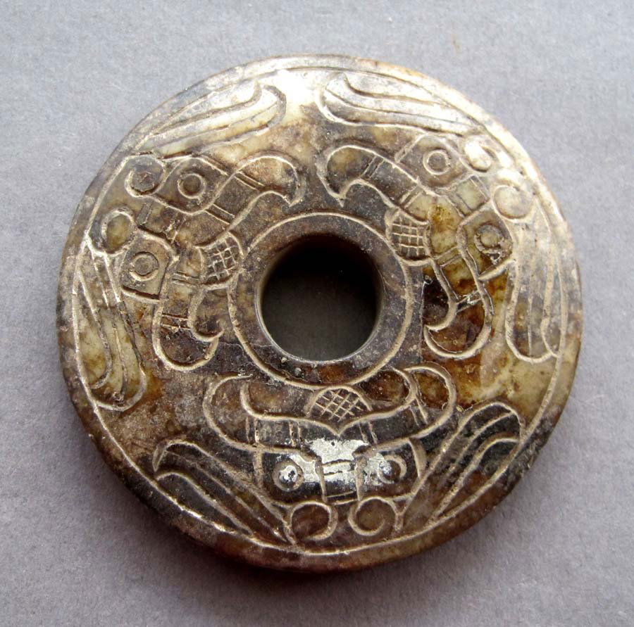 ANTIQUE 350 CT CHINESE JADE CARVING DISC: The Royal Cameo Carving Jade Charm was carved from a piece of fine grained Jade gemstone more than 200 years ago. The design is unique and very lovely and the carving is delicately performed. Size: 65
