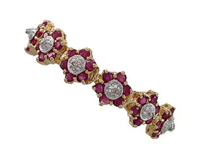 Genuine 9 CT Cabochon Ruby Diamond Bracelet: Master jewelers designed your bracelet with 132 pieces of GENUINE faceted cabochon rubies. 22 pieces of GENUINE single cut diamonds .9 carat tw. 17 grams of sterling silver layered with 18K Gold. The 