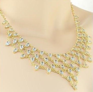 30.25 Cts Blue Topaz Elegant Designer Necklace $1,980!: 59 pieces of GENUINE Ovals Blue Topaz quality AAA no treatment. 27.48 grams of base metal layered with 18K yellow gold. The necklace length is around 18 inches.