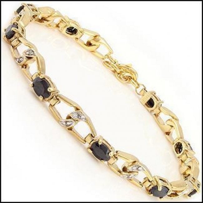 6.54 CT Sapphire & Diamond Designer Bracelet $1,490: 9 pieces of GENUINE 6X4mm oval black sapphires no treatment quality AAA.6 pieces of GENUINE single cut diamonds no treatment.10.21 grams of brass layered with 18K yellow gold.The length is around 7 1/