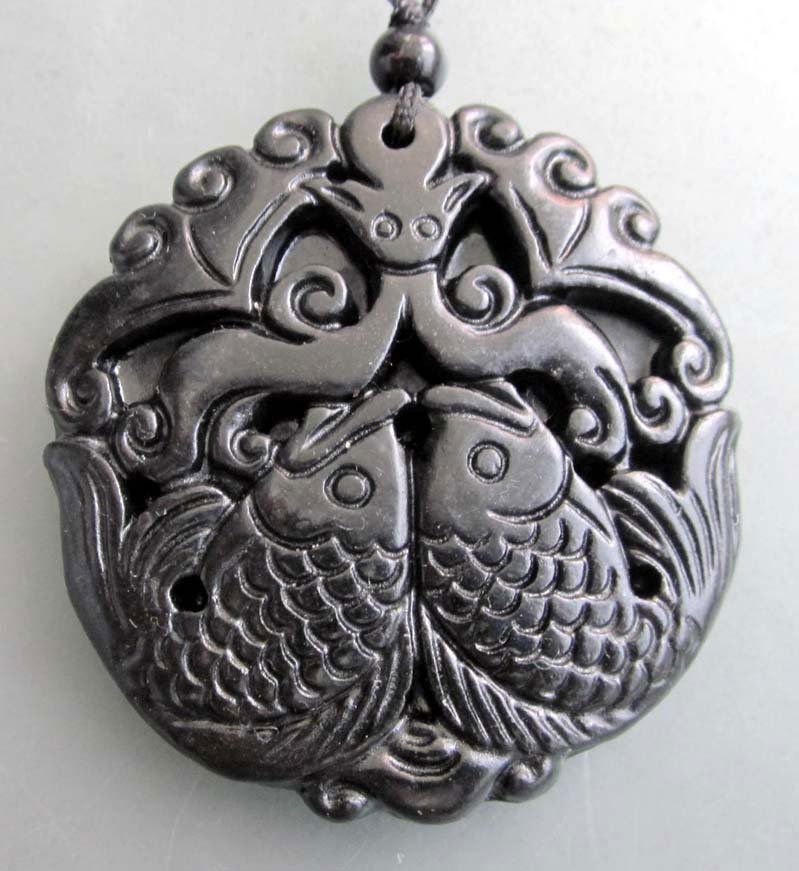 Royal Black Green Jade Twin Fish Amulet: Approx Size: 2" x 1 1/2". The Royal Cameo Carving Jade Charm was carved from a piece of fine grained Jade gemstone more than 200 years ago. The design is unique and very lovely and the carving is deli