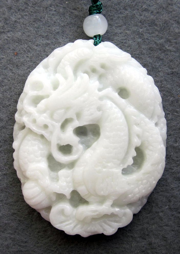 Handcrafted White Jade Mighty Pi-Xiu Dragon Pendan: Approx Size: 2" x 1 1/2". The Chinese love jade because of not only its beauty, but also more importantly its culture, meaning and humanity, as Confucius (551 BC - 479 BC) said there are 11 De (virtue