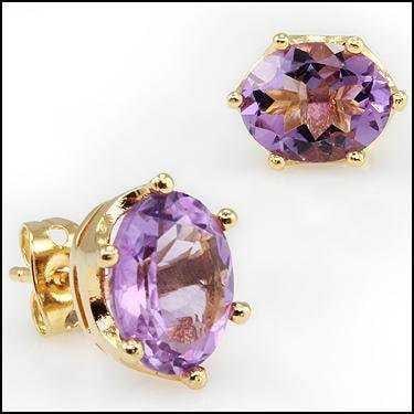 5.55 CT Amethyst Stud 18KGP Designer Earrings: 2 pieces of GENUINE 10x8mm ovals Amethysts quality AAA no treatment.2.70 grams of brass layered with 18K yellow gold.The motif width is 5/8 inches or 16mm.The motif height is 7/8 inches or 22mm.