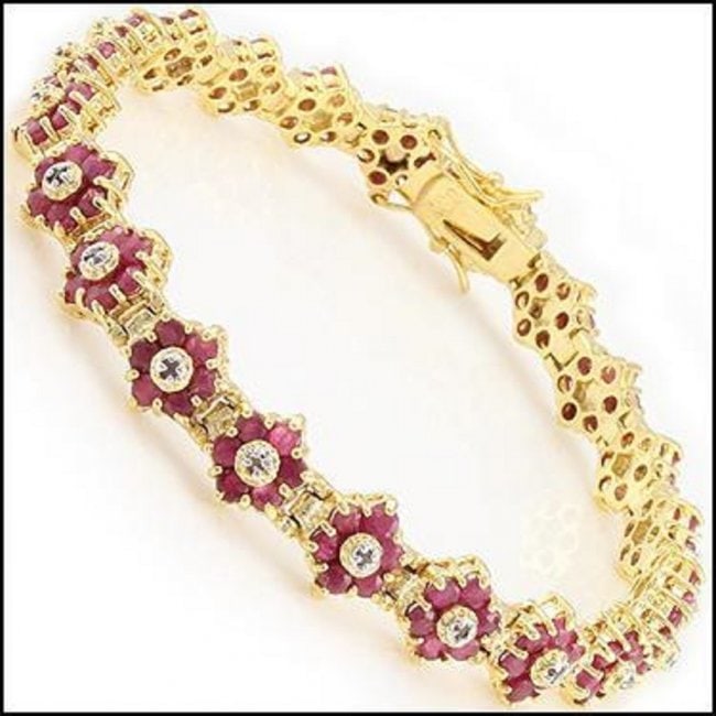 6.71 Ct Ruby & Diamond Designer Bracelet $1,840: 132 pieces of GENUINE 2.1mm Round Rubies quality AAA no treatment.22 pieces of GENUINE 1.1mm faceted round diamonds: 0.16 carat Tw.I-J color & I2-I3 Clarity no treatment.12.25 grams of brass layered w
