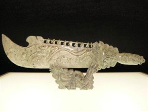 REAL JADE 9-RING DRAGON SWORD SET: This is a jade sword set, carved from one solid piece of jade, the base is separate. 9-ring is the highest ranking in ancient China for Warriors. There is a dragon carved on the front. Wide: 20", Deep