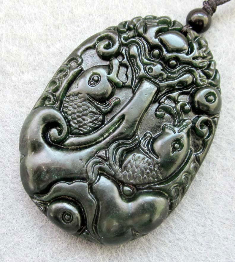 Royal Black Green Jade Twin Koi Fish Amulet: Approx Size: 2" x 1 1/2". The Royal Cameo Carving Jade Charm was carved from a piece of fine grained Jade gemstone more than 200 years ago. The design is unique and very lovely and the carving is deli