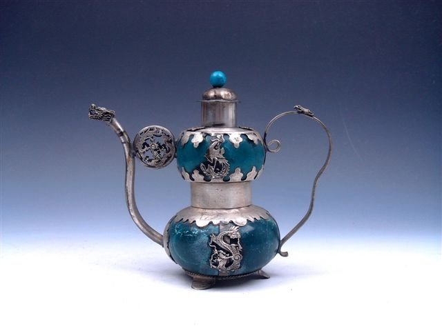 Tibetan Silver Dragon Phoenix Teapot Dragon Spout: Item Description: This is a very nice vintage Tibetan silver dragon phoenix armored tripod decorative teapot with dragon spout, excellent workmanship and the piece looks even more attractive in person
