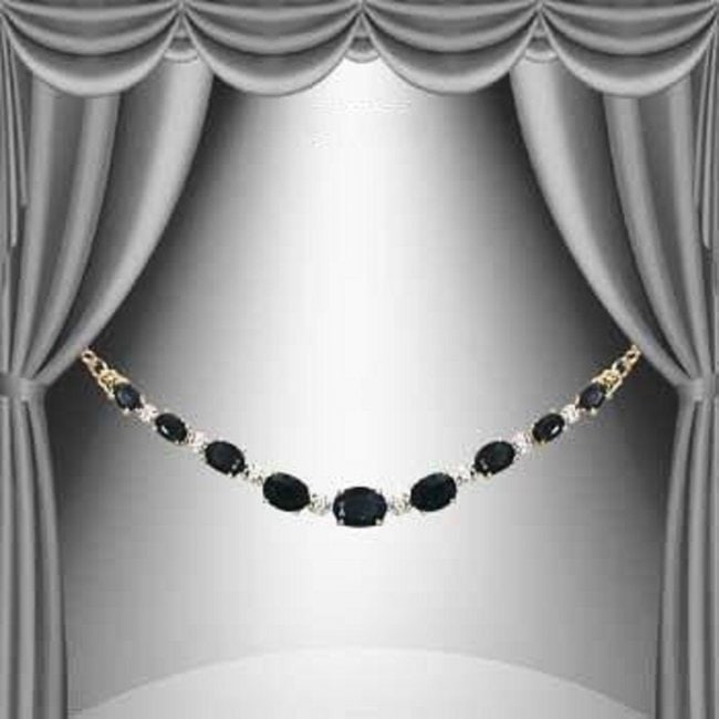 8.05 Cts Black Sapphire & Diamond 18KGP Designer: 9 pieces of GENUINE 8x4mm ovals Black Sapphires quality AAA no treatment.2 pieces of GENUINE single cut diamonds 0.02 carat Tw.8.65 grams of brass layered with 18K yellow Gold .The length is around 18