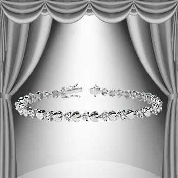 0.15 Ct Diamond 18KGP Designer Heart Bracelet: 21 Single cut round 1.1mm diamonds Color: I-J & Clarity: I2-I3 No treatment.10.05 grams of base metal layered with platinum rhodium.Length is 7 1/2 inches.The width is 1/4 inches.