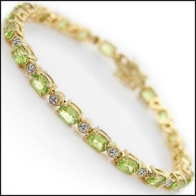 9.02 Ct Peridot & Diamond Designer Bracelet $1,335!: 20 pieces of GENUINE 6 X 4mm faceted Peridots .4 pieces of GENUINE 1.1mm faceted round diamonds, Color: I-J & Clarity: I2-I3 No treatment.11.42 grams of brass layered with 18K yellow gold.The bracelet