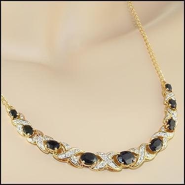 5.29 CT Sapphire & Diamond 18KGP Designer Necklace: 9 pieces of GENUINE Black Sapphires quality AAA no treatment.8 pieces of GENUINE 1.1mm faceted round diamond 0.06 carat Tw I-J color.10.48 grams of base metal layered with 18K yellow gold.The necklace