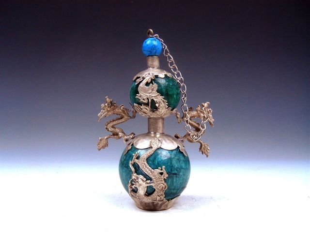 Tibetan Silver Dragon Phoenix Gourd Snuff Bottle: Item Description: This is a very nice Tibetan silver copper dragon and phoenix armored bottle gourd shaped snuff bottle with 2 dragon handles, excellent workmanship and the piece looks even more attra