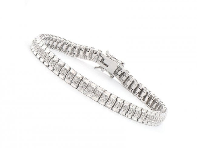 Plated Rhodium 0.58 ct Diamond Designer Bracelet $1,655: One Plated Rhodium 0.58ctw Diamond Bracelet. (58) round Diamonds with a color of I-J and clarity of I-3. Total weight of this bracelet is 14.75 grams. The length of this bracelet is 7 1/2 inches.