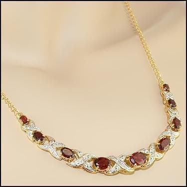 5.19 CT Garnet & Diamond Designer Necklace $1,500: 9 pieces of GENUINE Garnets quality AA no treatment.8 pieces of GENUINE 1.1mm faceted round diamond 0.06 carat Tw.9.48 grams of base metal layered with 18K yellow gold.The necklace length is around 18