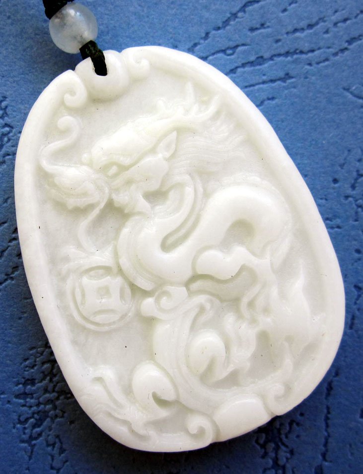 Zhou Dynasty White Jade Dragon Spit Pearl Amulet: Approx Size: 2" Diameter. It is the customary and traditional belief of Chinese people that wearing the jade is the good means of which people will be protected from bad luck, evil spirit and danger. 