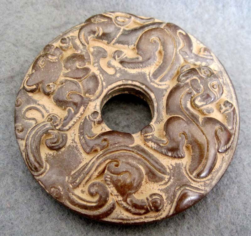 ANTIQUE 450 CT CHINESE JADE CARVING DISC: The Royal Cameo Carving Jade Charm was carved from a piece of fine grained Jade gemstone. The design is unique and very lovely and the carving is delicately performed. Size: 2 1/2" Translucency Grade