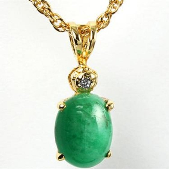 Genuine 1 1/2 CT Cabochon Emerald Diamond Pendant: Master jewelers designed your pendant with 1 piece of GENUINE 8X6mm oval GENUINE cabochon emerald. 1 piece of GENUINE single cut diamond .01 carat tw. 0.7 gram of brass layered with 18K Gold.