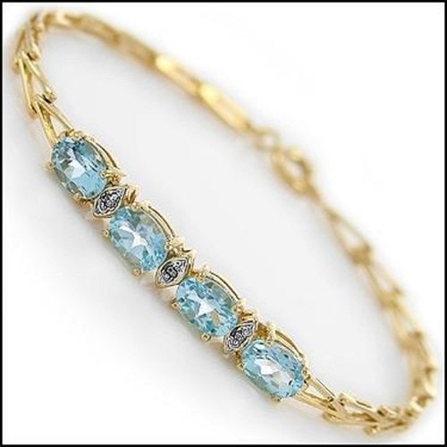 3.63 Cts Sky Blue Topaz & Diamond 18KGP Designer: 4 pieces of GENUINE 7x5 mm Oval Sky Blue Topaz.3 pieces of GENUINE 1.1 mm single cut diamonds, no treatment.5.05 grams of brass layered with 18K yellow gold.The length is 7 1/2 inches. The width is 1/