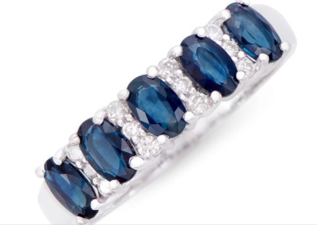 1.51 Cts Certified Natural Diamonds & Blue Sapphire 14K Gold Designer Ring: Gemstone: SapphireColor: BlueShape: OvalSize: 5x3Quantity: 5CTW: 1.34 Diamond DescriptionShape: RoundsSize: 1.4 mm Quantity: 12CTW: 0.17Grade: I1-I2Color: H-I Material Information:Primary Material: 14