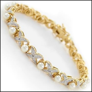 6mm Freshwater Pearl and Diamond Gold Bracelet: Master jewelers designed your bracelet with 17 pieces of 6mm freshwater pearls. 17 pieces of single cut diamonds, 0.1 carat tw. 11.4 grams of Base Metal layered with 18K Gold. The length is 7 1/2 inch