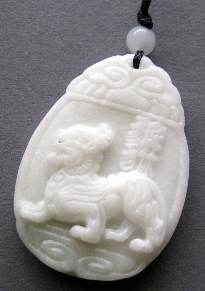 Zhou Dynasty Jade Mighty Foo Dog Amulet: Approx Size: 2" Diameter. It is the customary and traditional belief of Chinese people that wearing the jade is the good means of which people will be protected from bad luck, evil spirit and danger. 