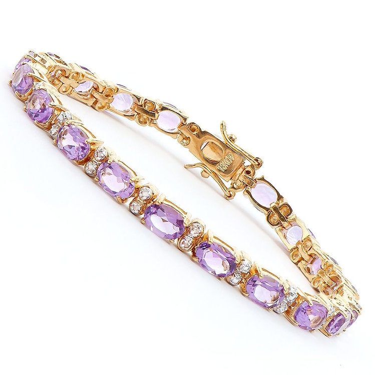 9.08 Cts Amethyst & Diamond 18KGP Designer Bracelet: 20 pieces of GENUINE 6 X 4mm faceted Amethysts. 4 pieces of GENUINE 1.1mm faceted round diamonds, Color: I-J & Clarity: I2-I3 No treatment.11.42 grams of brass layered with 18K yellow gold.The bracele