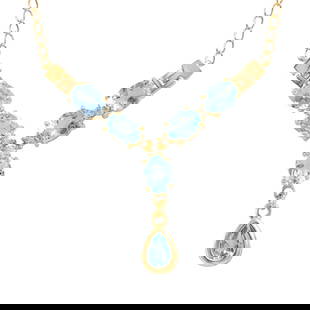Plated 18KT Yellow Gold 8.00ctw Blue and White Topaz Pendant with Chain: One Plated 18KT Yellow Gold 8.00ctw Blue and whiteTopaz Pendant with Chain. (6) Blue Topaz stones with a total weight of 8.00cts. (5) white topaz stones with a total weight of 0.25cts. 6.85 grams of b