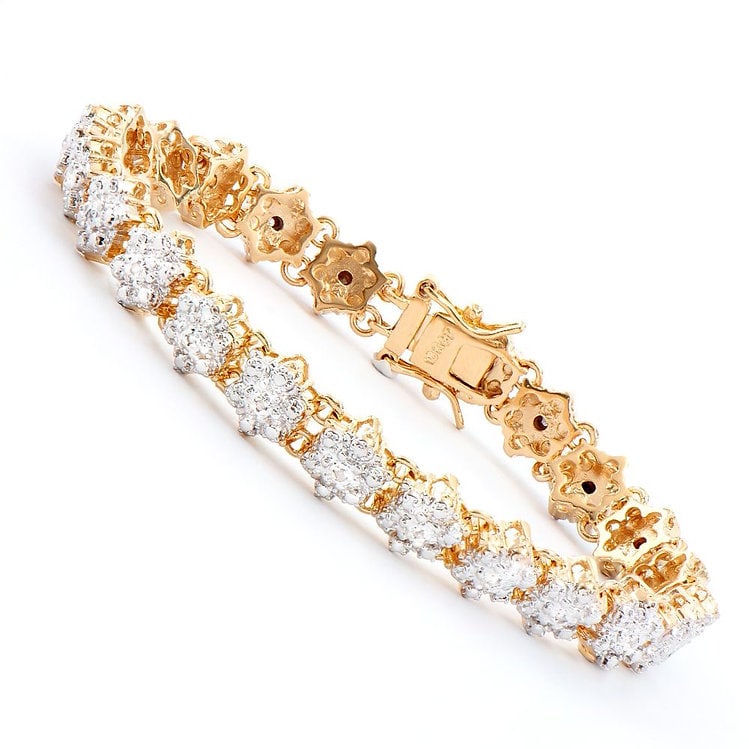 0.88 CT Diamond Designer Bracelet MSRP $1,625: 23 Single cut round diamonds Color: I & Clarity: SI2 No treatment. 11.35 grams of Base Metal layered with 18K yellow Gold. Length is 7 1/2 inches. The width is 1/4 inches.
