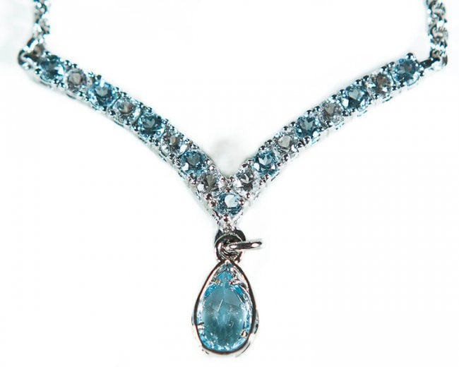 3.20 CT Blue & White Topaz Designer Necklace: 1 piece of GENUINE 9X6 mm pear shape Blue Topaz quality AAA no treatment.9 pieces of GENUINE 3mm rounds Blue Topaz quality AAA no treatment.8 pieces of GENUINE 3mm rounds white Topaz.6.05 grams of bra