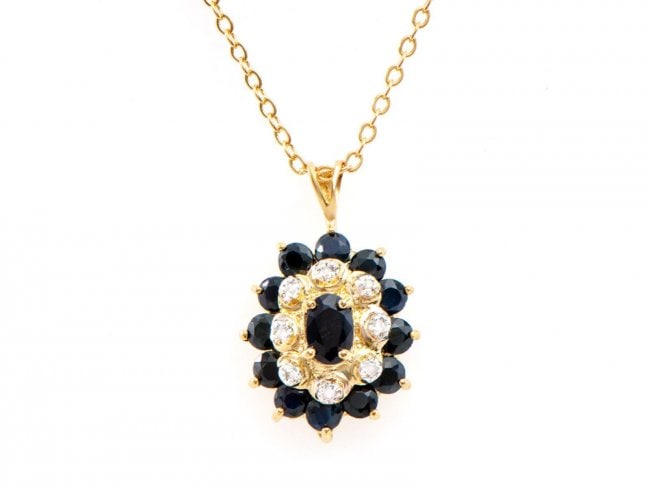 2.63 Ct Black Sapphire & Diamond Designer Necklace $995: One Plated 18KT Yellow Gold 2.60ctw Black Sapphire and Diamond Pendant with Chain. (1) center black Sapphire measuring 6x4mm. (12) black Sapphires measuring 3.1mm. (8) round diamonds measuring 1.1mm.