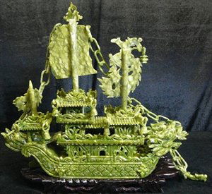 24" GREEN JADE DRAGON BOAT: This jade boat is made from natural green jade. It consists of boat body, chains, sails, flag, anchor, rudder, and wooden base. Very detailed carving. LENGTH: 24", HEIGHT: 24", WIDTH: 6".