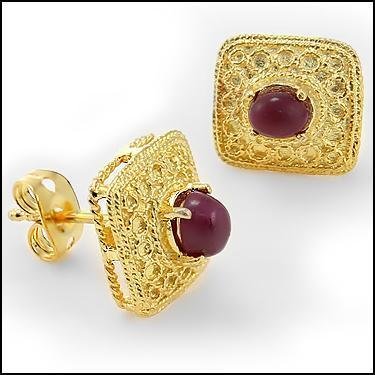 1 CT Cabochon Ruby Stud Antiqued Earrings: Master jewelers designed your earrings with 2 pieces of GENUINE 5X4mm faceted oval cabochon rubies. 1.3 grams of sterling silver layered with 18K Gold.