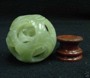 REAL JADE 3 LAYER PUZZLE BALL: THIS WONDERFUL PIECE OF WORK IS MADE OF REAL JADE. IN ONE PIECE OF SOLID JADE, WE CARVED IN A FEW LAYERS AND IT IS CARVED FROM INSIDE OUT. THE MOST INTERESTING PART OF THIS ITEM IS THAT ALL THE BALLS 