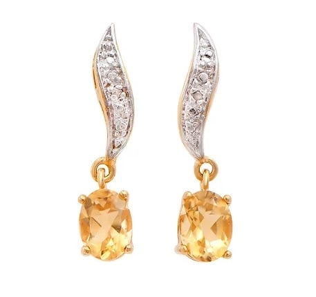 2.06 Cts Natural Citrine Diamonds 18K Gold Plated Designer Earrings $1,260!: Gemstone DescriptionGemstone: CitrineColor: OrangeShape: OvalSize: 8x6Quantity: 2CTW: 2.04 Diamond DescriptionShape: RoundsSize: 1.2mm Quantity: 2CTW: 0.02Grade: I3Color: H-I Material Information:Plat