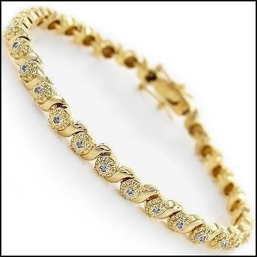 0.32 Cts Diamond 18KGP Designer Bracelet $1,810: 30 Single cut 1.2 mm round diamonds no treatment I2-I3 & J color.12.32 grams of brass layered with 18K yellow Gold.Length is 7 1/2 inches.The width is 1/4 inches.