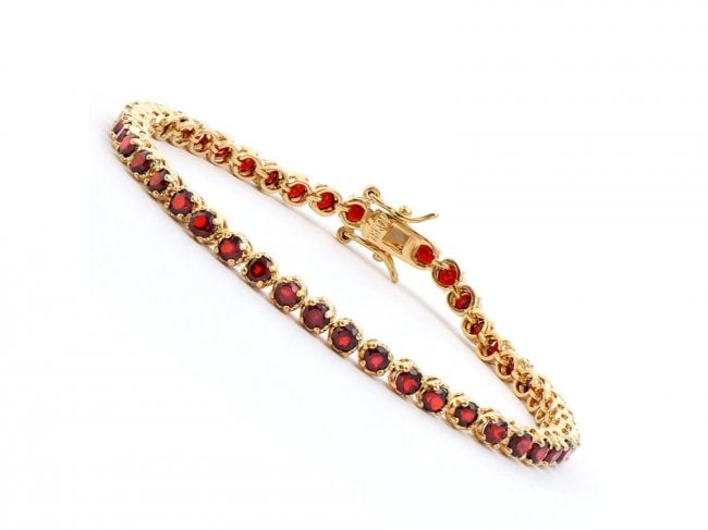3.62 Cts Designer Garnet Tennis Bracelet $1,115: One Plated 18KT Yellow Gold 3.60ctw Garnet Bracelet. (46) Garnet stones with a total weight of 3.60cts. Total weight of 6.85 grams of brass layered with 18K yellow gold. The length of this bracelet is