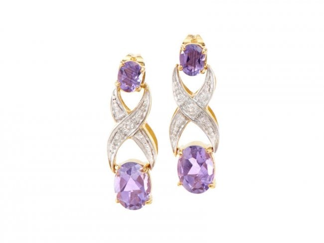 2.72 ct Amethyst and Diamond Designer Earrings $770: One Plated 18KT Yellow Gold 2.72ctw Amethyst and Diamond Earrings. (2) amethyst stones measuring 8x6mm. (2) amethyst stones measuring 5x4mm. Diamonds with a total weight of 0.02cts. Total weight of
