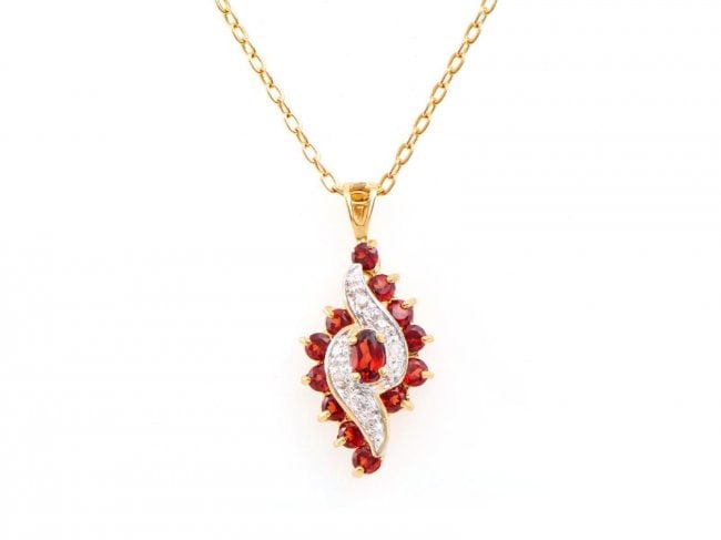1.16 Cts Garnet & Diamond Designer Necklace $990: One Plated 18KT Yellow Gold 1.16ctw Garnet and Diamond Pendant with Chain. 13 pieces of Garnet with a total weight of 1.16cts. 6 pieces of 1.2mm round diamonds. Total weight of this pendant with