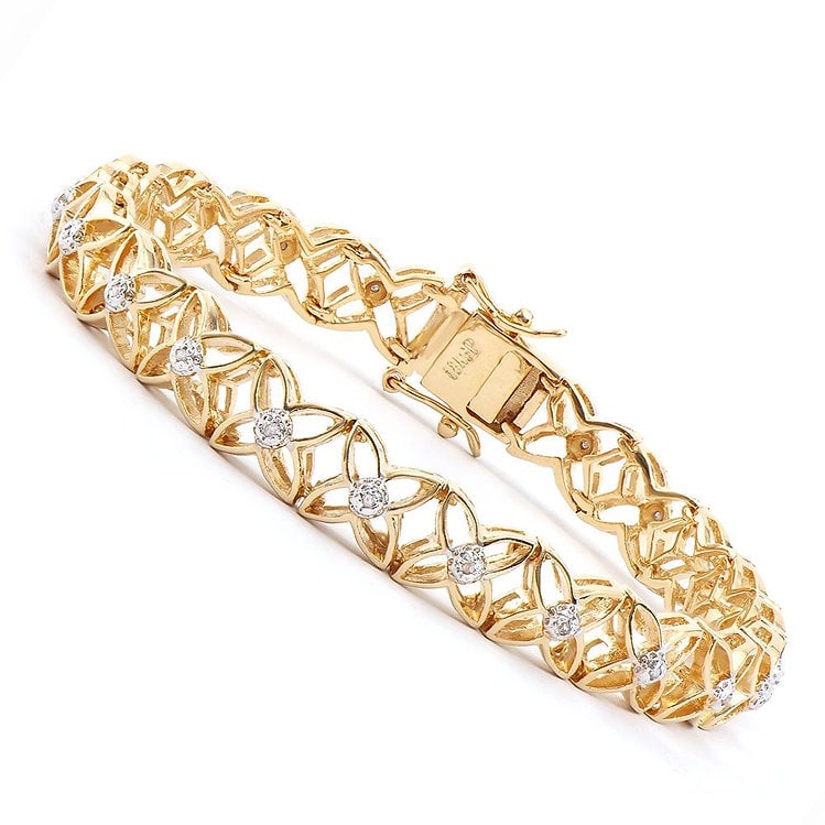 0.15 Cts Diamond Designer 18KGP Bracelet $1,570: 21 Single cut 1.1mm round diamonds Color: I-J & Clarity: I2-I3 No treatment. PRJEWELRYENDS13.25 grams of brass layered with 18K yellow Gold.Length is 7 1/2 inches.The width is 1/4 inches.