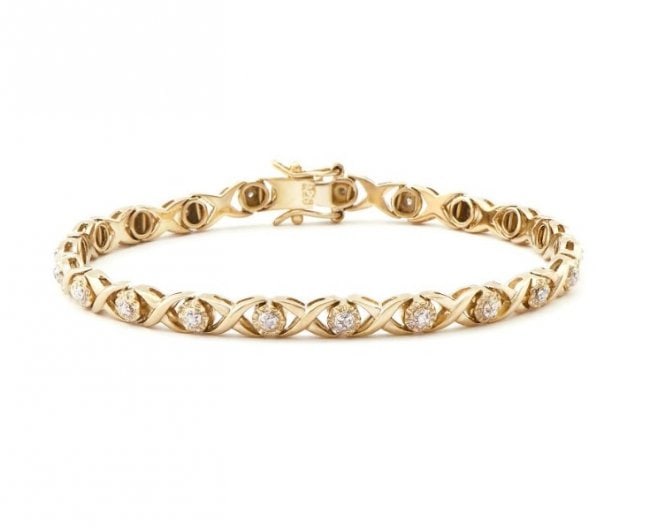 0.21 Cts Diamond 18KGP XOX Designer Bracelet: 21 Single cut 1.2 mm round diamonds no treatment I2-I3 & J color.11.55 grams of brass layered with 18K yellow Gold.Length is 7 1/2 inches.The width is 1/4 inches.