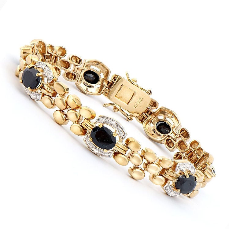 11.05 Cts Sapphire & Diamond Designer Bracelet $1,775!: One Plated 18KT Yellow Gold 11.00ctw Black Sapphire and Diamond Bracelet. (7) Black Sapphire stones with a total weight of 11.00cts. (14) Diamonds with a total weight of 0.10cts with a color of I-J an