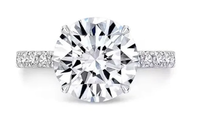 $4,115 Value! 1.24 CTW IGI Certified Lab Grown Diamonds E-F VVS2 Designer Ring NEW: Main Lab Grown Diamond Description: Shape: Round Brilliant CutSize: 6.90mm Quantity: 1Grade: VVS2Color: E-F?Side Lab Grown Diamonds Description: Shape: RoundsSize: 1.3mm Quantity: 18Grade: VVS2Color: